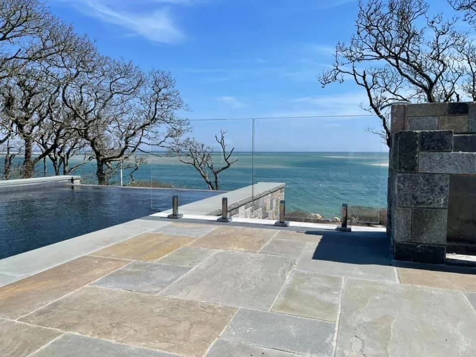 Glass railing overlooking water